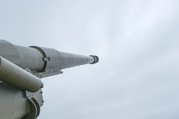 Long barreled artillery gun pointing upwards