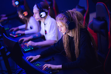 Team professional gamer playing tournaments online games computer eSport © Parilov