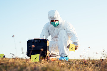 Criminologist investigates a crime scene.