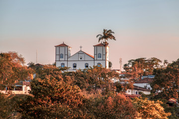 Pirenopolis, Goias, Brazil, October 18, 2019: The landscape at the end of the day and the towers of Nossa Senhora do Ros&aacute;rio Church in the historic center of Pirenopolis