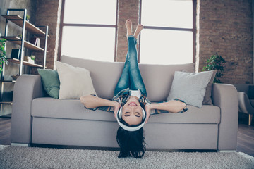 Full length photo of amazing funny lady listening favorite radio fm in modern earflaps raising legs...