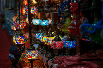 Multi-colored lamps in the eastern bazaar. Shop of oriental souvenirs.