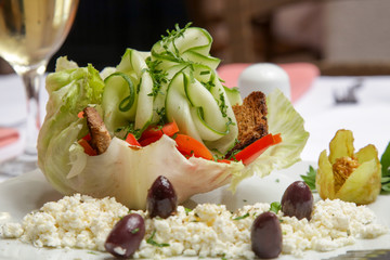 Greek salad served in a cabbage leaf