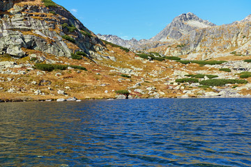 Beautiful mountain lake among peaks of High Tatra mountains - The autumn Pleso nad Skokom in High Tatras National Park in Slovakia © andras_csontos