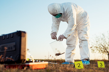 Criminologist investigates a crime scene.