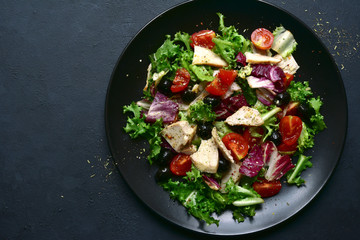 Vegetable salad with chicken and spicy citrus dressing. Top view with copy space.