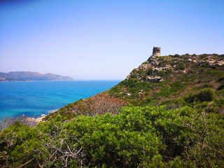 Fototapeta na wymiar The Spanish watchtower of Porto Giunco, Villasimius, Sardinia, Italy,
