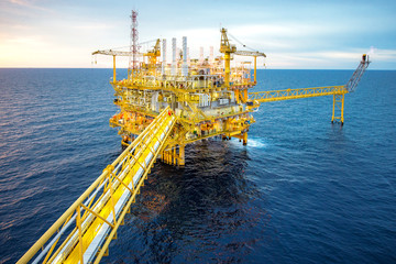 Offshore oil and gas rig platform with beautiful sky in the gulf of Thailand.