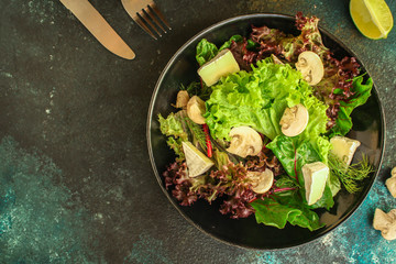 healthy salad mushrooms, cheese and green leaves (snack dish, vegetables, arugula, lettuce, spinach and more) menu concept. food background. copy space. Top view