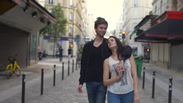 Couple walking in the streets of Paris, France