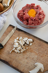 Top view of ingredients for meatballs with porcini mushrooms (edible Boletus)