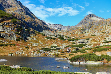 Peaks of  the Tatra mountains and the autumn Pleso nad Skokom lake in High Tatras National Park in Slovakia © andras_csontos