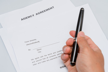  Agency contract form and fountain pen