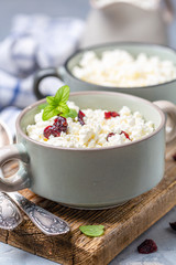 Cottage cheese with dried cranberries in a bowl.