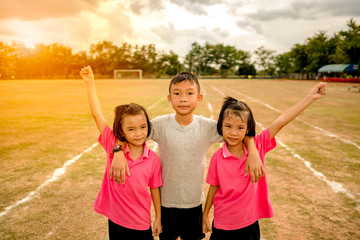 Kids family brother and sisters playing and running in sport day of school