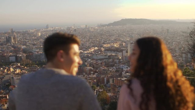 Two friends looking at the city of Barcelona, Spain
