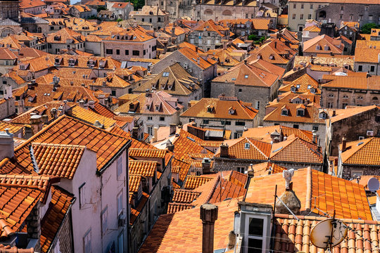 Old stone houses with red roofs in old historic Dubrovnik city, n sunny summer day, Dalmatia, Croatia, nice background image, the most popular touristic destination