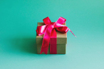 Gift box on mint background.