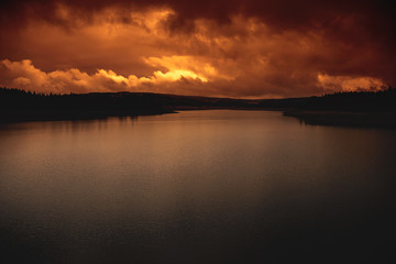 Fototapeta na wymiar Scenic view of colorful sunset over lake