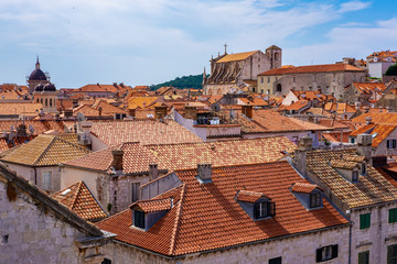 Old stone houses with red roofs in Dubrovnik city stone walls, Dalmatia, Croatia, sunny summer day, the most popular touristic travel destination  