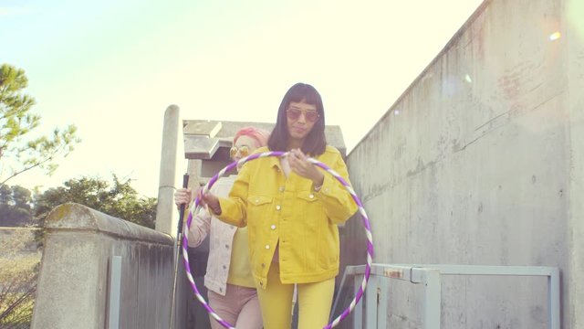Bizarre fashionable women walking on steps