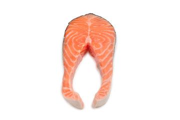 Raw salmon steak isolated on white.