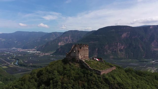 Aerial view. A beautiful panorama of the ruins of Castelchiaro castle in the municipality of Kaltern in South Tyrol, Italy. Flying on drone.