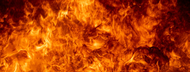 Close up hot fire flame burning glowing on black dark background