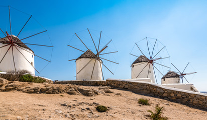 Traditional whitewashed windmills in Mykonos town, Greece.