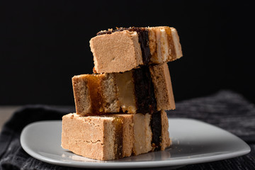 Delicious peruvian dessert called King Kong with dulce de leche and jam.