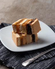 Delicious peruvian dessert called King Kong with dulce de leche and jam.