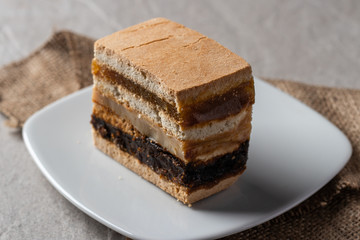 Delicious peruvian dessert called King Kong with dulce de leche and jam.