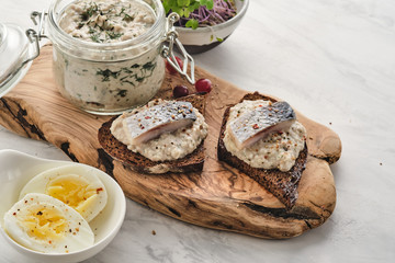 Forshmak - traditional Jewish cuisine. Sandwich with minced herring fillets with apple, onion and egg.