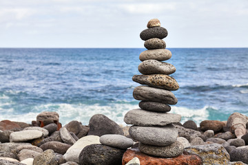 Stone stack on a beach, balance and harmony concept, selective focus.