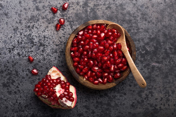 Fresh sliced pomergranate on a plate on a table