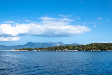 View of Corfu island from the deck of a sea ferry, Greece