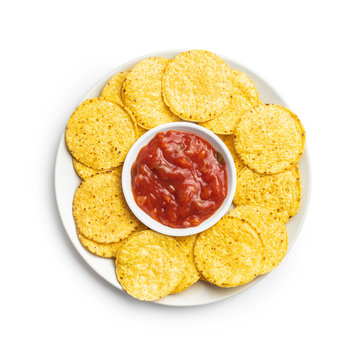 Round Corn Nacho Chips And Tomato Dip. Yellow Tortilla Chips And Salsa