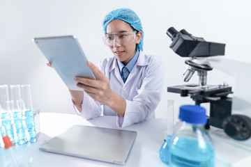 Scientists are working with digital tablet in laboratory