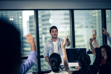Big team discussing business plans at meeting