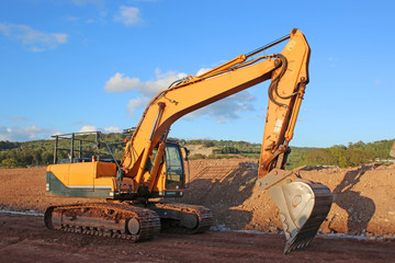 Fototapeta na wymiar Digger on a road construction site