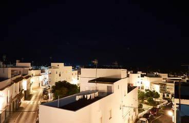 Las calles de Conil de la Frontera iluminadas por la noche, en la provincia de Cádiz. Andalucía....