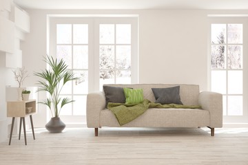Stylish room in white color with sofa and winter landscape in window. Scandinavian interior design. 3D illustration