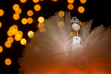 ballerina doll with bokeh lights