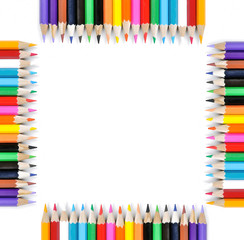 Frame of colored pencils isolated on white background