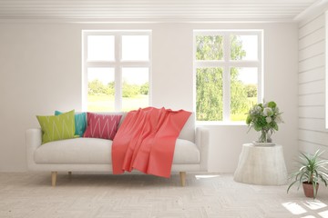 Stylish room in white color with colorful sofa and summer landscape in window. Scandinavian interior design. 3D illustration