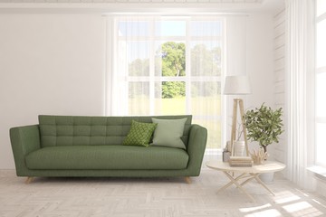 Stylish room in white color with sofa and summer landscape in window. Scandinavian interior design. 3D illustration