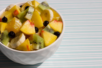 Fototapeta na wymiar Fruit salad. Tasty and healthy breakfast