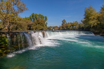 Fototapeta premium under a bright blue sky you can see the waterfall of Manavgat