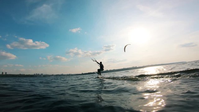 Person doing kite surfing on water.