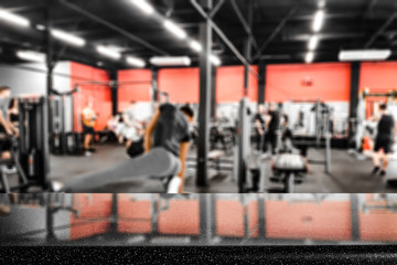 Fototapeta premium Dumbbell, barbell and workout in the gym. Copy space with blurred gym background.